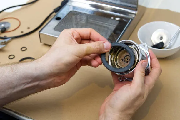 A professional technician inspecting a semi-automatic espresso unit to provide expert coffee machine repair Abu Dhabi.