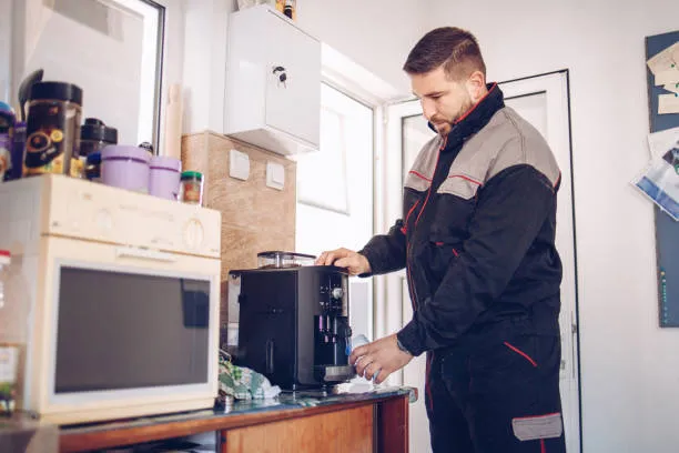 A skilled repairman replacing a rubber gasket seal on a coffee machine group head during a coffee machine repair Abu Dhabi visit.